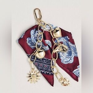 Anthropologie Heritage Bag Charm Burgundy scarf keychain with gold chain
